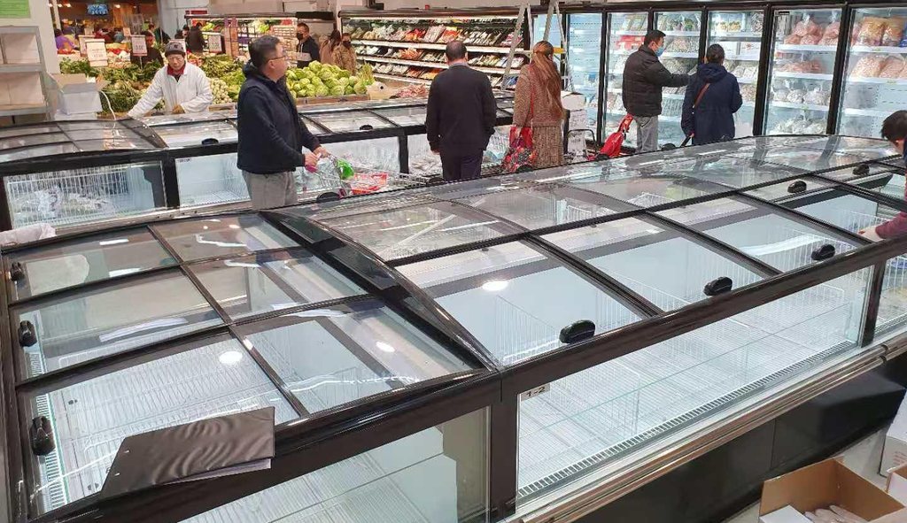 First Select glass-top island freezers installed in a supermarket